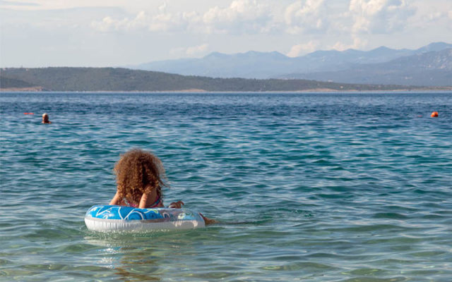 Child swimming in the sea