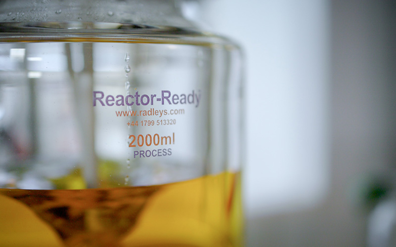 Close up of 2000 mL Reactor-Ready with orange liquid